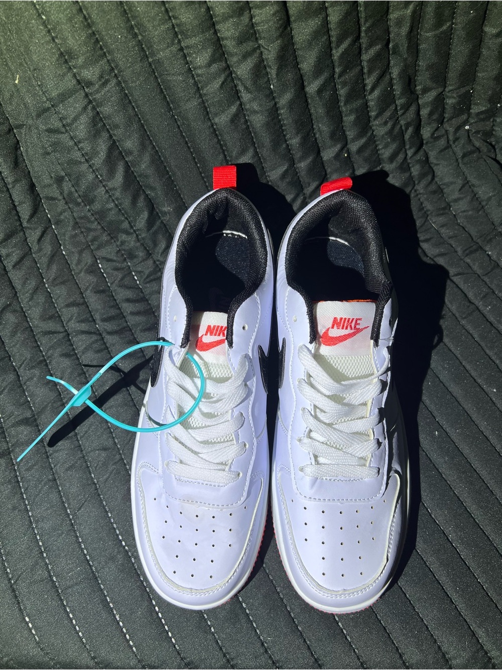 Nike White Low-Top Sneakers with Black Swoosh and Red Outsole - Picture 4 of 8